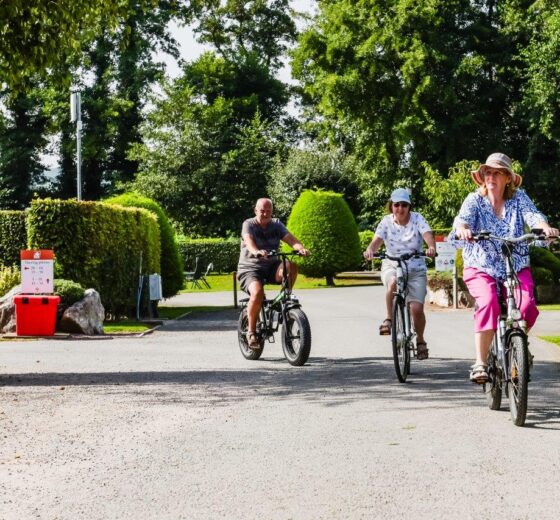 three people cycling